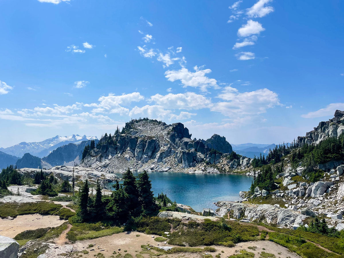 Mountainous landscape with a lake and clear blue sky